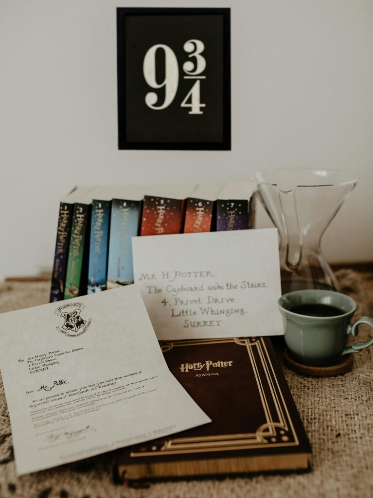 Charming display of Harry Potter books with coffee and letter, evoking magic and fantasy.